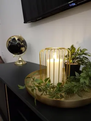 a candle sitting on top of a table at ANDREAS lux apartman in Niš