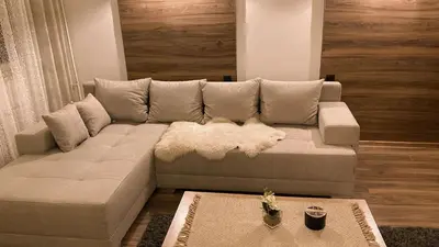 a living room with a couch and a table at Bagi Apartmani in Raška