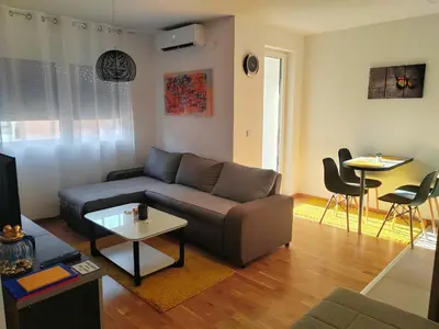 a living room with a couch and a table at For You in Vrnjci