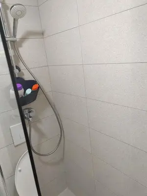 a shower in a bathroom with a shower head at For You in Vrnjci