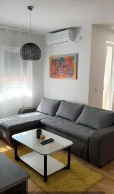 a living room with a couch and a coffee table at For You in Vrnjci