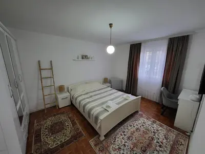 a bedroom with a bed and a ladder in it at Apartman Ogledalce, 51m2, potpuno opremljeno, Kruševac Smeštaj in Kruševac