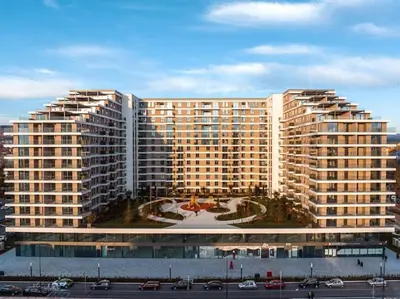 a large building with a courtyard in front of it at Residence Lux apartman & Spa in Niš