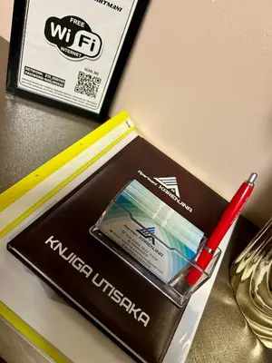 a red pen in a box on a table at KARENJINA Apartmani in Vranje