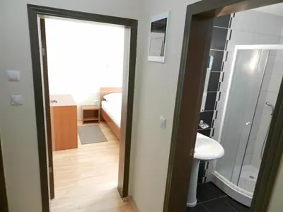a bathroom with a mirror and a sink in a room at Villa MILSA Half Board & Pool in Soko Banja