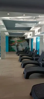 a room with a row of chairs in a building at Apartman Simona President Kop in Kopaonik