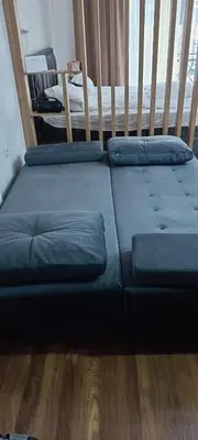 a couch sitting on the floor in a room at Apartman Simona President Kop in Kopaonik