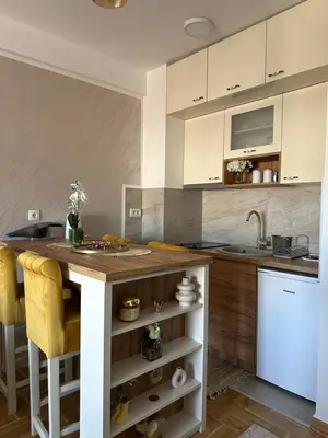 a kitchen with a wooden counter and a sink at Dorin Kutak in Vrnjačka Banja