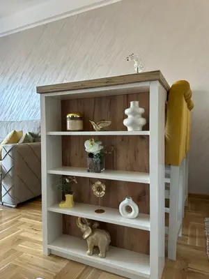 a white book shelf in a living room at Dorin Kutak in Vrnjačka Banja