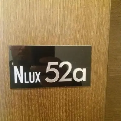 a sign that says nuk on a door at Milmari Resort Spa and Wellness, Nlux 52a in Kopaonik