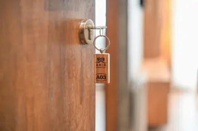 a key tag hanging from a door handle at Zeleni vrh A03 in Kopaonik