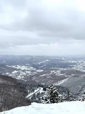 a view from the top of a snow covered mountain at Zeleni vrh A03 in Kopaonik