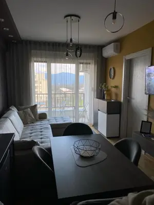 a living room with a table and a couch at Astera 1 in Vrnjci