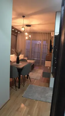 a living room with a table and a dining room at Astera 1 in Vrnjci