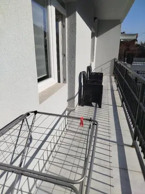 a pair of chairs on a balcony of a building at Cera residence apartment in Soko Banja
