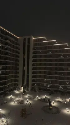 a large building is lit up at night at Planet A in Niš