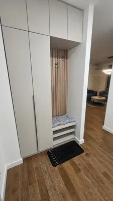 a room with a cupboard and a door in a room at Planet A in Niš