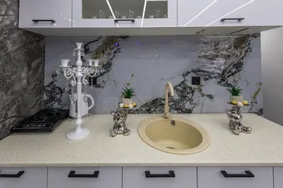 a bathroom counter with a sink and a sink at Matija Lux in Kraljevo