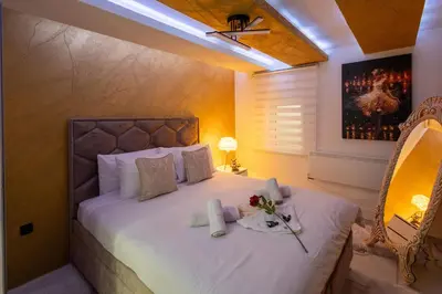 a bedroom with a bed with flowers on it at Matija Lux in Kraljevo