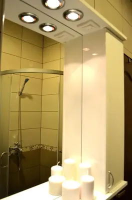 a bathroom with a shower and a sink with towels at Apartmants Night Lux in Niš