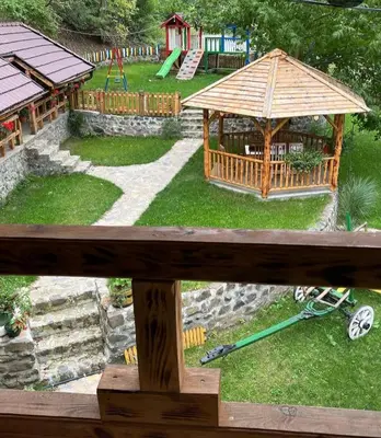 a view of a playground with a gazebo at Ribnjak Filopivic in Pleš