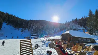 a group of people sitting in chairs in the snow at Sunčani Breg app 8 in Kopaonik