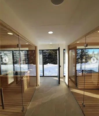 an empty hallway with glass doors and windows at Sunčani Breg app 8 in Kopaonik