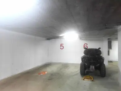 a parking garage with a motorcycle parked in it at Porta Porta 22 Kopaonik - free garage in Kopaonik