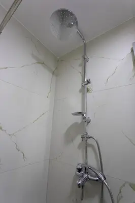 a shower with a shower head in a bathroom at Porta Porta 22 Kopaonik - free garage in Kopaonik