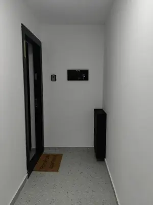 a room with a white wall and a door at Porta Porta 22 Kopaonik - free garage in Kopaonik