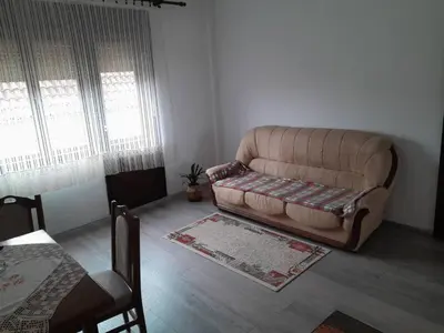 a living room with a couch and a table at Nebo in Soko Banja