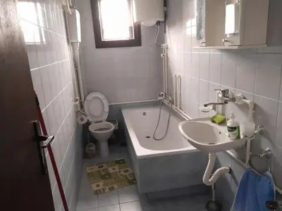 a bathroom with a tub and a sink and a toilet at Nebo in Soko Banja