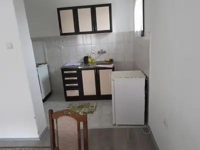 a small kitchen with a sink and a refrigerator at Nebo in Soko Banja