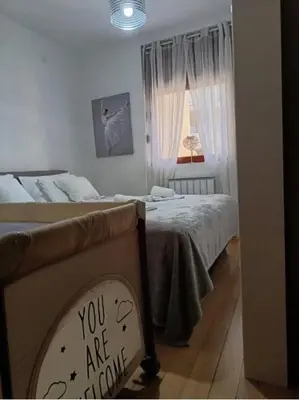 a bedroom with two beds and a sign that says you are coming at Nektar 88 Lux in Vrnjačka Banja