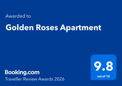 a blue sign with the words golden roses appointment at Golden Roses Apartment in Niš