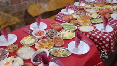 a table full of food on a red table at Etno selo Katunija in Katun