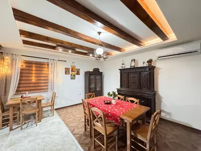 a dining room with a table and chairs at Etno selo Katunija in Katun
