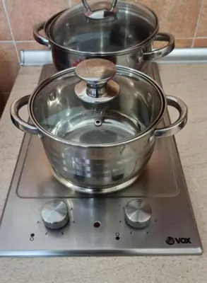 two pots sitting on top of a stove at Apolon Spa Lux in Vrnjačka Banja