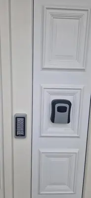 a white door with a tv on it at Plavi Dom in Ćuprija