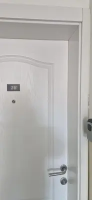 a white door in a room with at Plavi Dom in Ćuprija