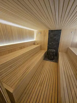 a small wooden sauna with a wooden floor at Tontic Lux Residence Hill 54 in Kopaonik