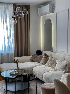 a living room with a couch and a table at Zlatkovic Family in Pirot