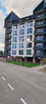 a large building on the side of a street at Residence Hill apartment TammyMatty in Kopaonik