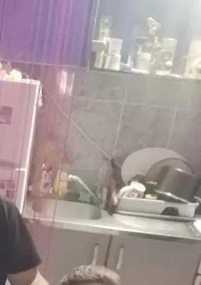 a kitchen with a sink and a counter with dishes at Zorana in Niš