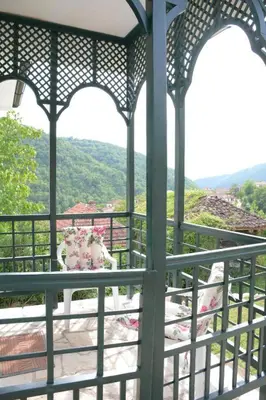 a view of a gazebo with flowers on it at Serbina in Kandalica