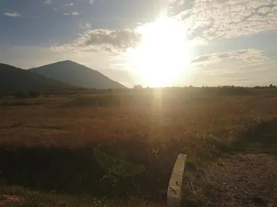 a field with the sun shining in a field at Musical Pansion Radgost, Rtanj in Rtanj