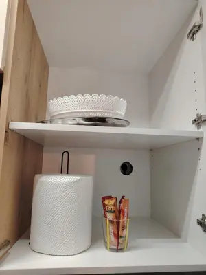 a shelf with a roll of toilet paper on it at Apartman Bonbon in Vrnjačka Banja