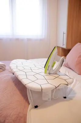 a laptop computer sitting on top of a bed at Apartman Babić Lux in Vrnjačka Banja