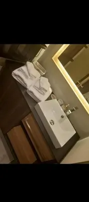 a bathroom with a sink and a mirror at WOODside 70m2 Kopaonik in Kopaonik