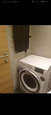 a washer and dryer in a bathroom at WOODside 70m2 Kopaonik in Kopaonik
